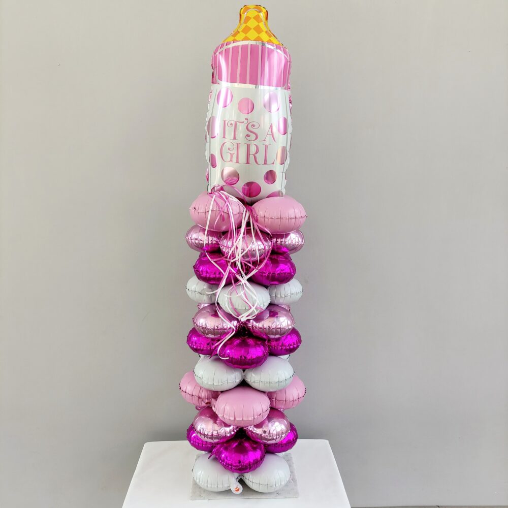 COMPOSITION OF BALLOONS WITH A BOTTLE OF PINK IN A COLUMN