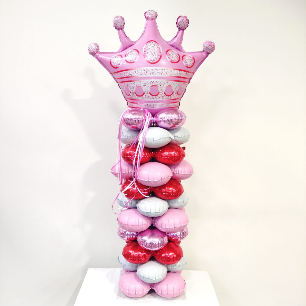 COMPOSITION OF BALLOONS WITH PINK CROWN IN A COLUMN