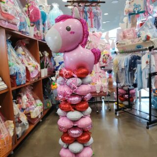 PINK HORSE BALLOON COMPOSITION IN A COLUMN FOR A NEWBORN GIRLPINK HORSE BALLOON COMPOSITION IN A COLUMN FOR A NEWBORN GIRL